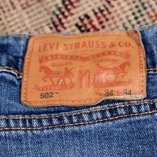 Levi's 502 W34 L30 Tapered Leg Regular Fit Classic Ripped Style Blue Denim Jeans